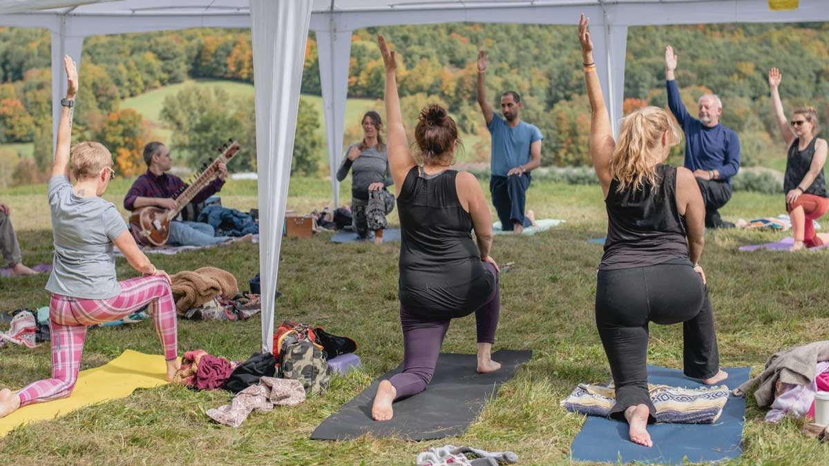 Yoga Plus Magazine - Yoga Reaches Out - People doing yoga at Gillette stadium